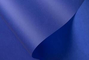 Elegant royal blue tracing paper background with a matte finish and subtle wavy folds. Translucent photo