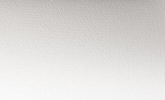 White paper background with a fine matte texture and subtle grain. The soft, neutral tones create a photo