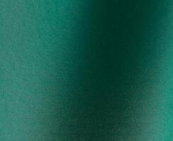 Emerald green paper background with a matte finish and subtle gradient. Premium texture with a rich photo