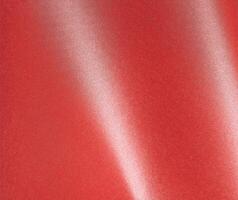 Elegant red paper background with a rich ruby gradient and glossy metallic sheen. Smooth and photo