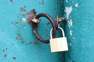 A Rusty Lock Positioned on a Weathered and Aged Surface, Signifying Time and Use photo