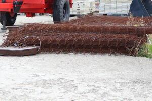 A Rusty Roll of Barbed Wire Found at a Construction Site Used for Various Purposes photo