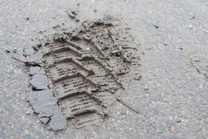 Imprint of Tire Tracks in a Wet Surface, Capturing Unique Details and Textures of Nature photo