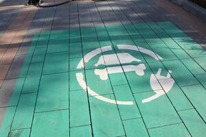 This image shows the Electric Vehicle Charging Station Symbol on the pavement as a driver marker photo