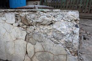 The Cracked Concrete Surface Exhibits Intriguing and Interesting Texture Details and Features photo