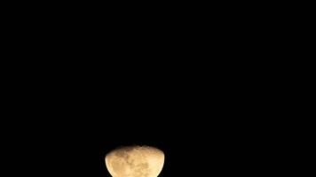 Time lapse of the moon and the clouds blowing in the wind. The moon in December. Silhouettes of the moon, stars, planets and landscapes. video