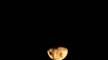Time lapse of the moon and the clouds blowing in the wind. The moon in December. Silhouettes of the moon, stars, planets and landscapes. video