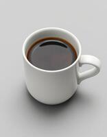 Freshly brewed black coffee in a white ceramic cup on a clean surface for an invigorating start to the day photo