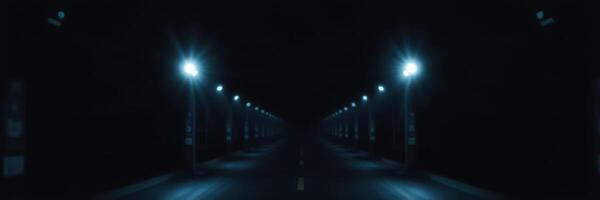 Dark urban street illuminated by distant blue streetlights at night with a sense of mystery and isolation photo