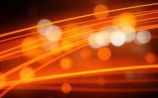 Vibrant orange and white light trails create an energetic atmosphere during a night event in a cityscape photo
