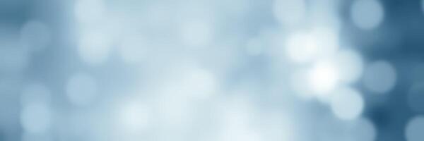 Soft blue bokeh background creates a serene and calming atmosphere for various creative projects photo