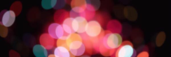 Colorful bokeh lights create a festive atmosphere during a nighttime celebration with vibrant hues and soft focus photo
