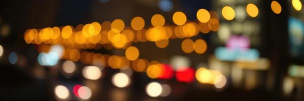 Nighttime cityscape features glowing lights and blurred traffic among tall buildings during busy hours photo