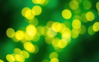 Vibrant green background featuring blurred yellow bokeh lights creating a festive atmosphere in a joyful celebration photo