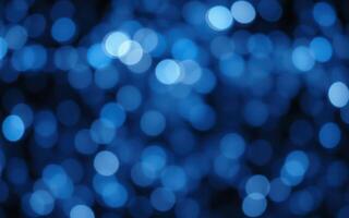 Colorful bokeh lights create a captivating blue atmosphere during a nighttime celebration photo