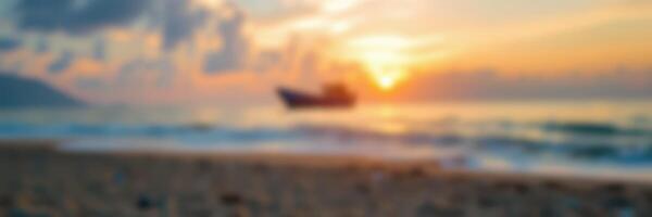 Beautiful sunset over calm ocean with boat silhouetted against the vibrant sky at a peaceful beach location photo