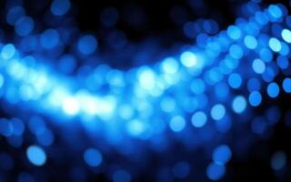 Vibrant blue bokeh lights create a mesmerizing atmosphere at a nighttime event photo