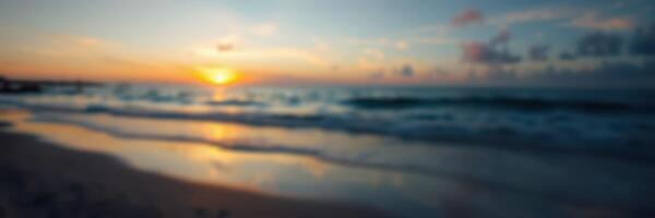 Beautiful sunset over calm ocean waters reflecting orange and blue hues at the beach during twilight photo