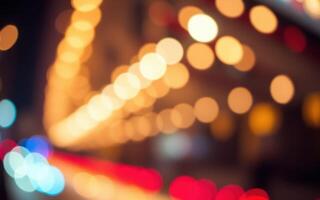 Colorful bokeh lights create a festive atmosphere on a lively city street at night photo