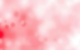 Abstract pattern showcasing soft red and pink hues with blurry highlights creating a dreamy atmosphere photo