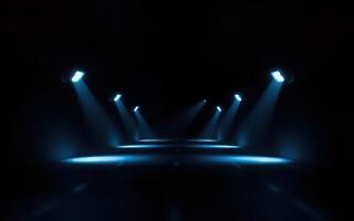 Dramatic blue light beams illuminate an empty stage ready for a performance in an auditorium photo