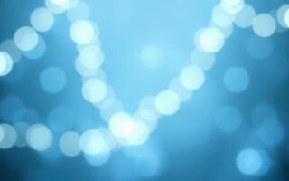 Soft blue bokeh lights create a tranquil atmosphere at an evening event photo