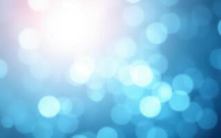 Soft blue bokeh light pattern creates a serene and calming atmosphere for creative projects and designs photo