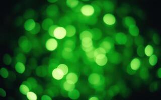 Lush green bokeh lights creating a vibrant and calming atmosphere at a festive outdoor gathering in the evening photo