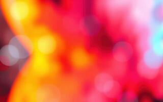 Colorful abstract background featuring vibrant red, yellow, and orange hues with soft bokeh effects creating a dynamic visual atmosphere photo