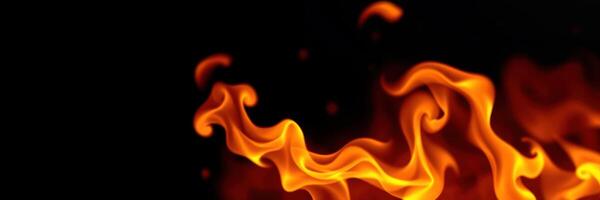 Flames flicker and dance against a dark background, creating a mesmerizing display of orange and red hues photo