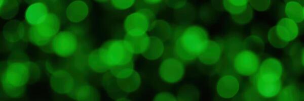Green bokeh lights create a dreamy atmosphere during a nighttime event in an urban setting photo