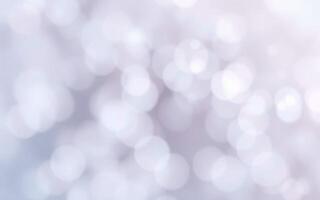 Soft white bokeh background creates a dreamy atmosphere for various design projects photo
