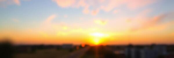 Sunset over a city skyline with vibrant colors creating a beautiful evening atmosphere photo
