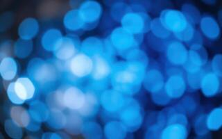 Colorful blue bokeh effect creates an abstract background filled with vivid circles of light in a mesmerizing pattern photo