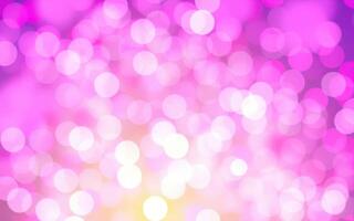 Colorful abstract background with luminous bokeh lights in shades of pink and yellow during an evening event photo
