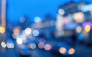 City nightlife illuminates streets with vibrant lights and blurred motion creating an enchanting urban atmosphere photo