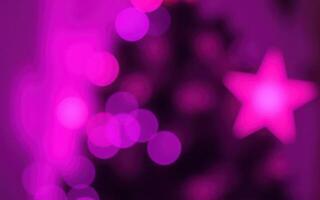 Vibrant pink and purple bokeh lights create a festive atmosphere during the holiday season at a cozy home gathering photo