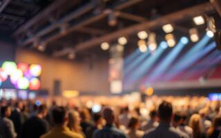 Large crowd at a lively event with colorful lights and a vibrant atmosphere in an indoor venue during the evening photo