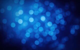 Colorful bokeh lights create a mesmerizing blue background during the evening hours photo