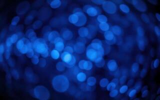 Vibrant blue bokeh lights create an enchanting abstract backdrop for evening celebrations photo