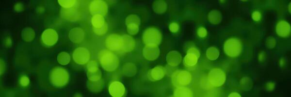 Green bokeh background with soft circular lights creating a tranquil atmosphere for design purposes photo