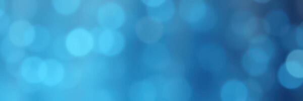 Vibrant abstract background featuring soft blue bokeh effects creating a serene and calming atmosphere during a summer evening photo