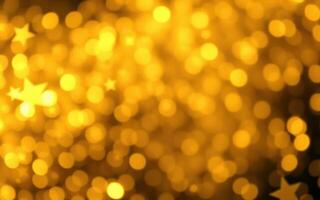 Golden bokeh background with star shapes created by lights in a festive atmosphere photo