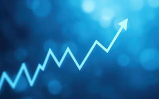 Blue abstract background with upward trending line indicating growth or success over time photo
