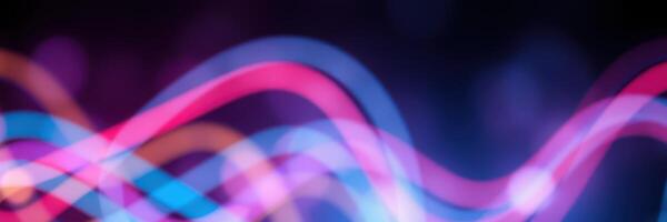 Colorful light patterns create a vibrant atmosphere at a nighttime event in a city setting photo