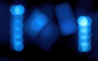 Vibrant blue lights create an abstract display with shapes in motion, captivating viewers at night event photo