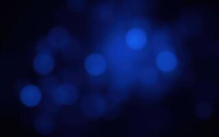 Abstract blue bokeh background with varying light intensity and softness creating a dreamy atmosphere photo