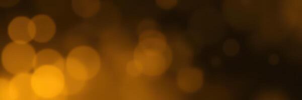 Bright golden bokeh lights create a warm and festive atmosphere suitable for celebrations or cozy gatherings photo