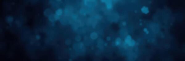 Vibrant blue bokeh background creates a calming atmosphere with sparkling light reflections and a modern, abstract aesthetic photo
