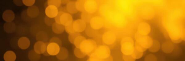 Golden bokeh lights create a warm, festive atmosphere during a celebration in the evening photo